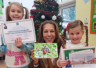 Left to Right: Overall winner Daisy Davies (7), Helen Grant MP, and highly commended entrant Ruby Pearce aged 4, both of Sissinghurst C of E Primary.